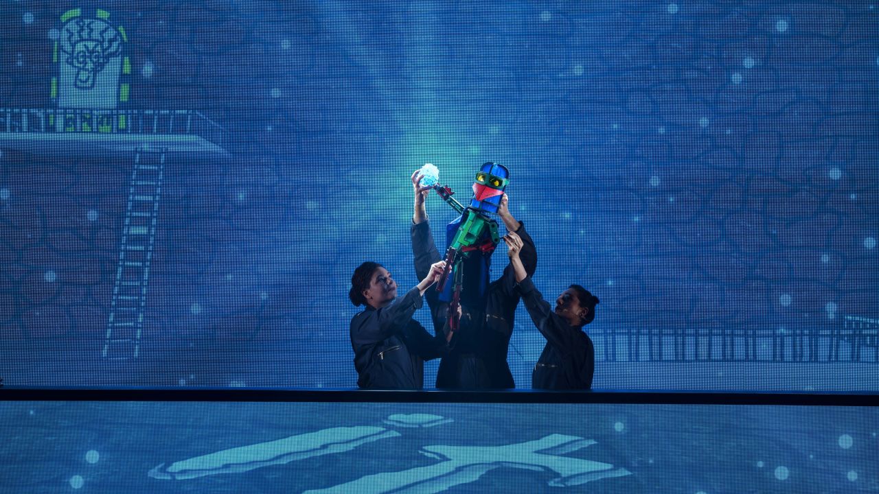 2017 Dead Puppet Society production of Laser Beak Man. 3 cast members on stage with puppet 