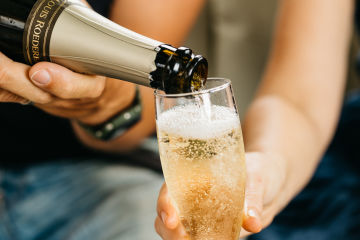 Close up of someone pouring champagne