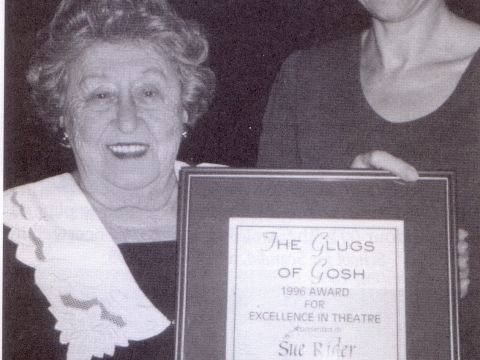 Babette Stephens presents Sue Rider with the Glugs of Gosh Excellence in Theatre Award for 1996.